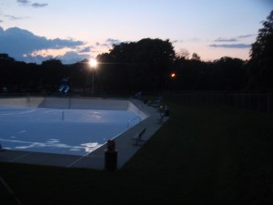 Pool, June 2010. Dusk. The empty pool reflects the sky.